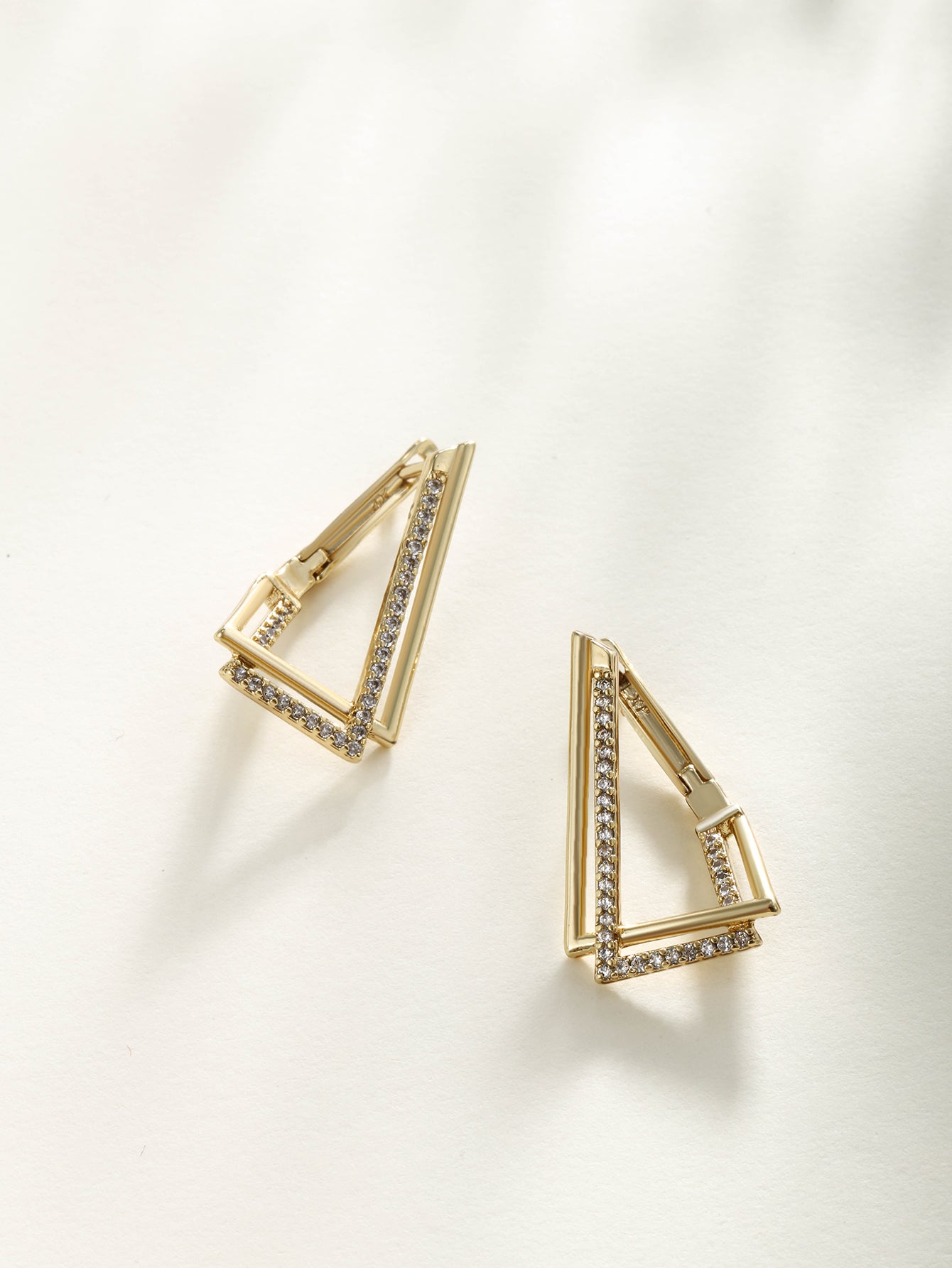 Fashionable, minimalist, and personalized 14K gold plated earrings with irregular triangular ear loops