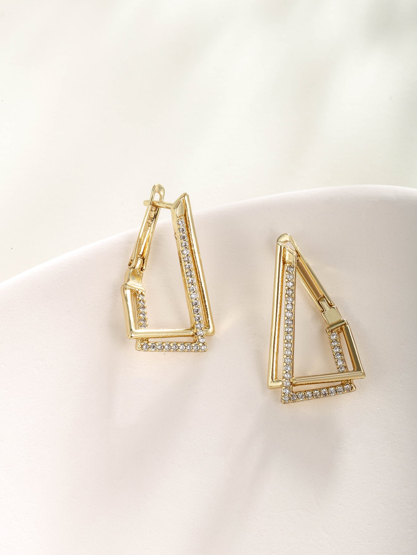 Fashionable, minimalist, and personalized 14K gold plated earrings with irregular triangular ear loops