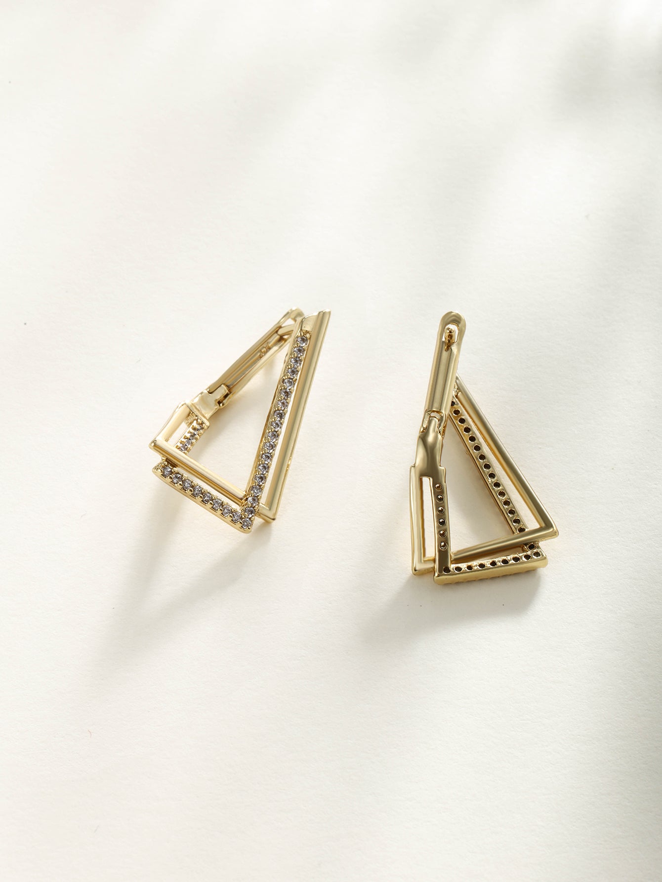 Fashionable, minimalist, and personalized 14K gold plated earrings with irregular triangular ear loops